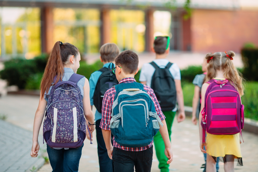 group kids going school together